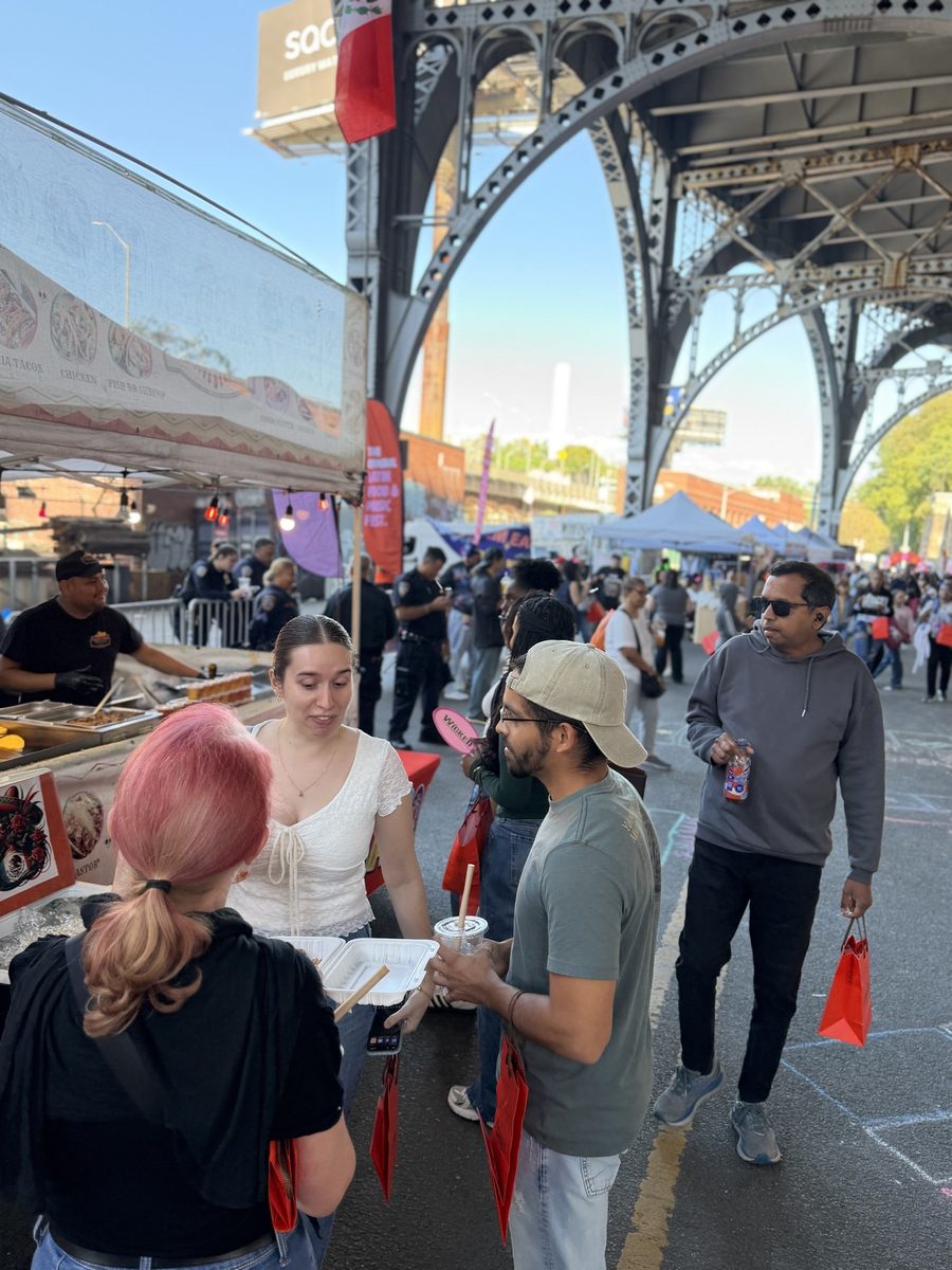 Crowd under the iron arches of the viaduct at Latin Food Fest NYC 2026